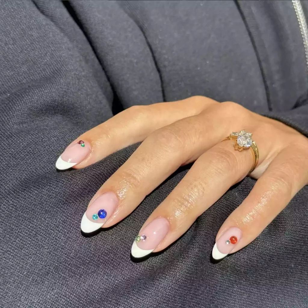 White French tip nails with gemstone details by nailtherapy.co
