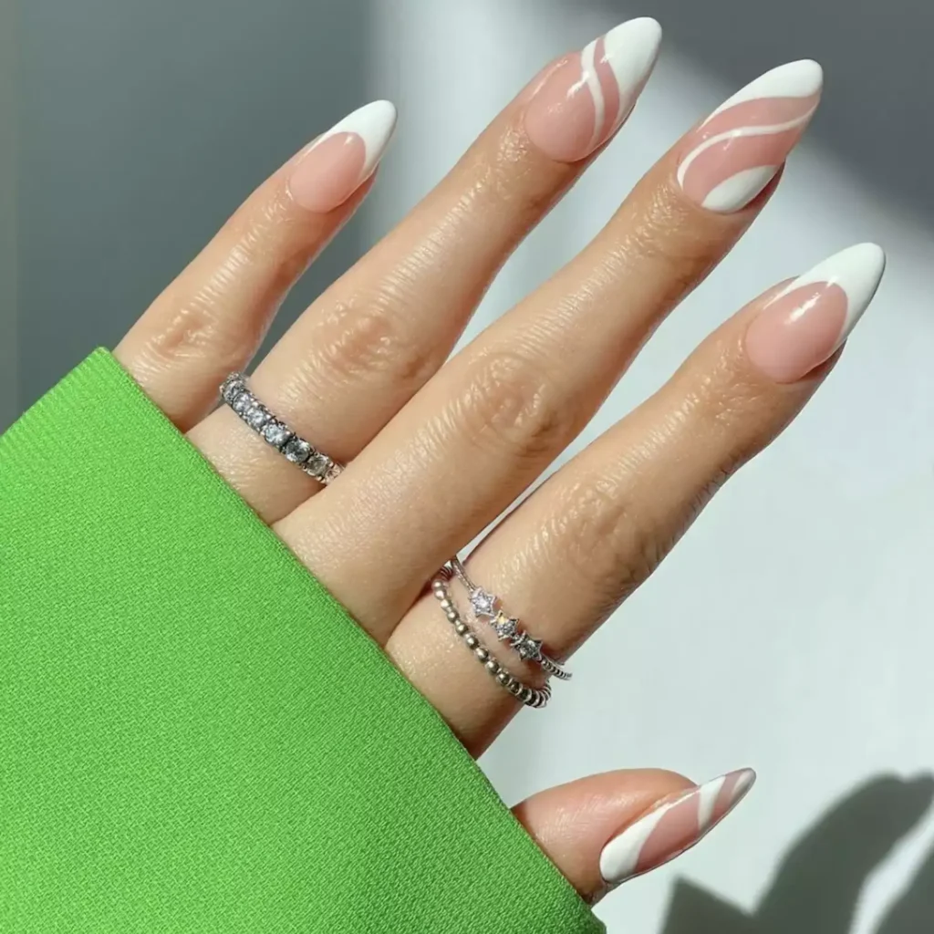 White French tip nails with pattern and negative space by disseynails
