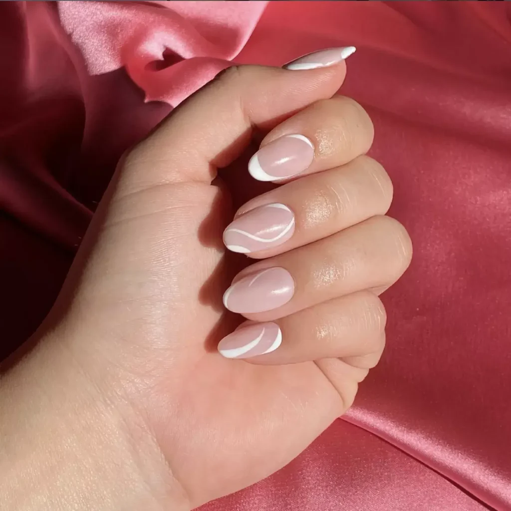 White French tip nails with swirl design above tip by nailtherapy.co
