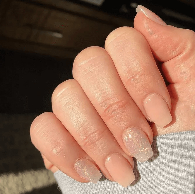 Barely-there nude acrylics with a hint of glitter. by charlieellen
