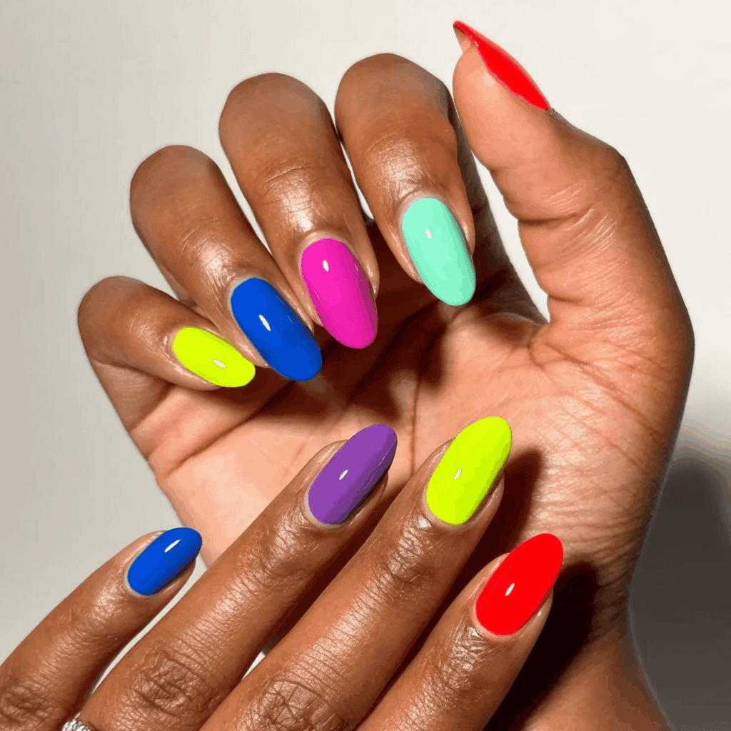 Bright, mood-boosting neon colored nails. by brushedbyb_