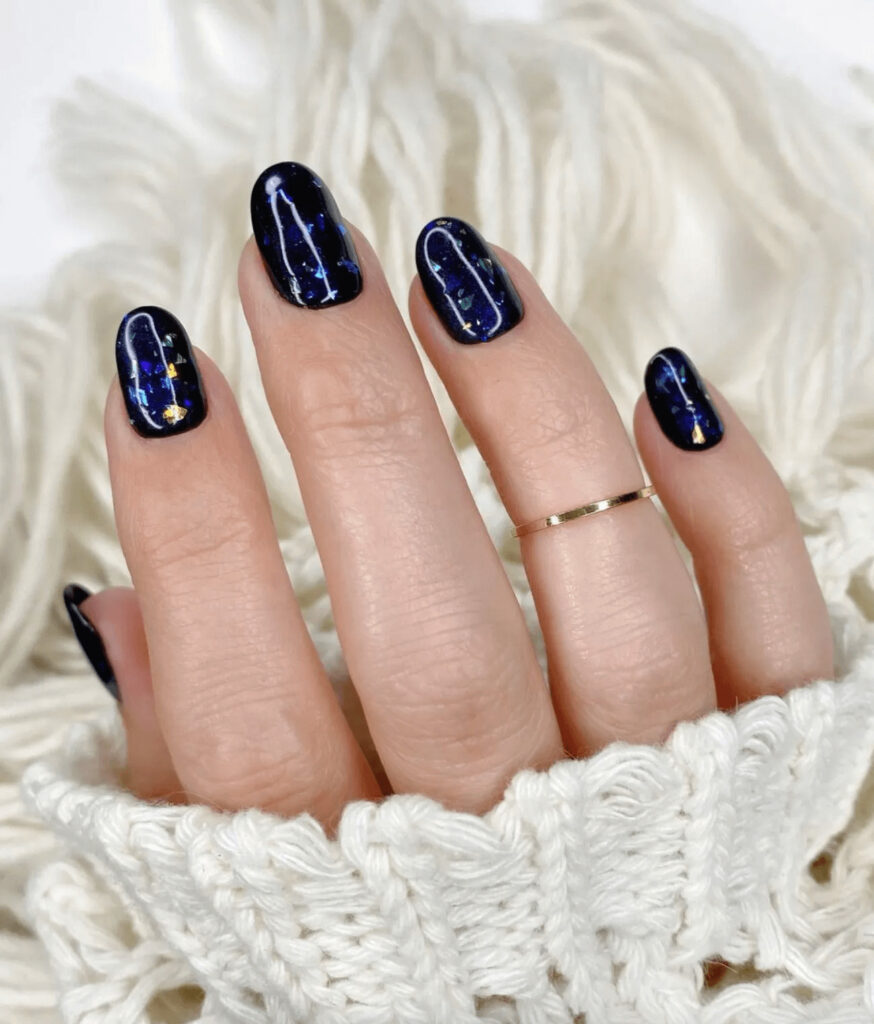 Deep navy manicure with chunky cosmic sparkle. by nails_of_la
