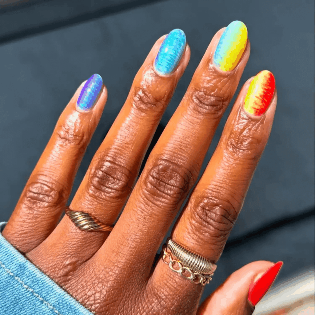Dual tie-dye shimmer nails in rainbow colors. by lolo.nailedit