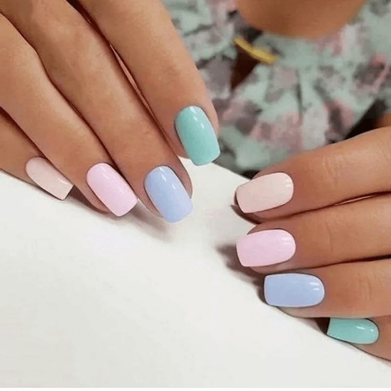 Each short acrylic nail painted a different pastel colour. by nailsonpoiint
