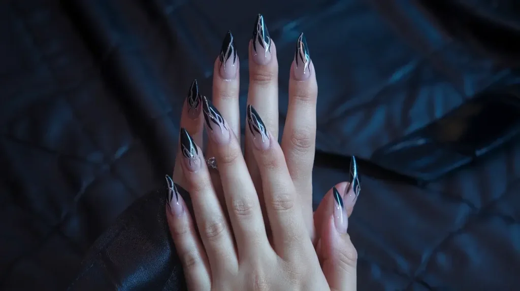 Example of long stiletto shaped nail tips, tapering dramatically to a sharp point. by nailbeautyguide