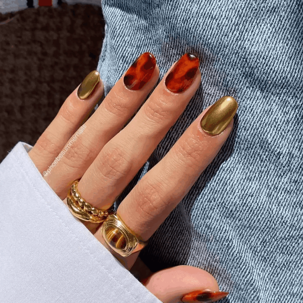 Gold chrome nails mixed with classic tortoiseshell nail art. by phoebesummernails
