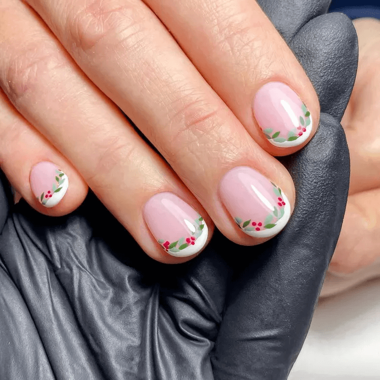 Micro French tips with delicate green wreath art on the base. by onenailtorulethemall