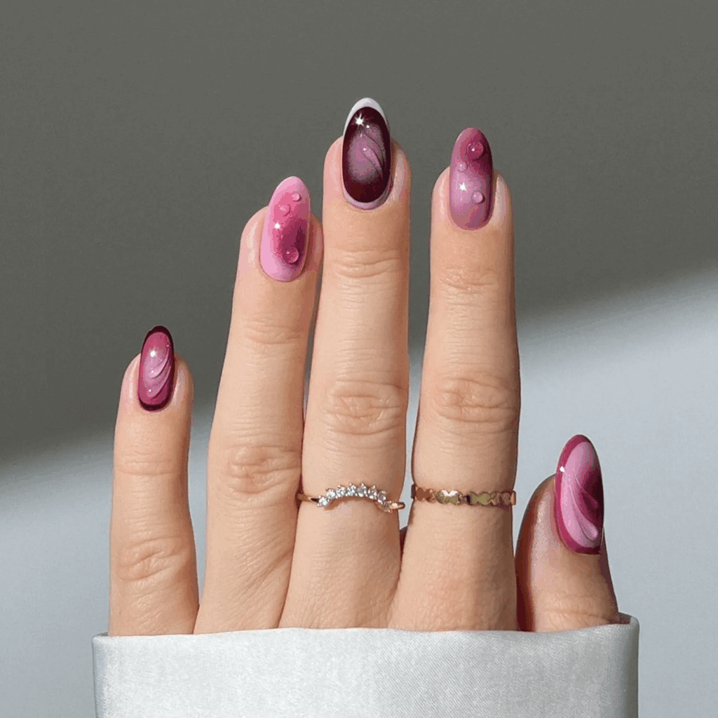 Mixed plum, mauve, and raspberry shades with clear builder gel accents. by heygreatnails