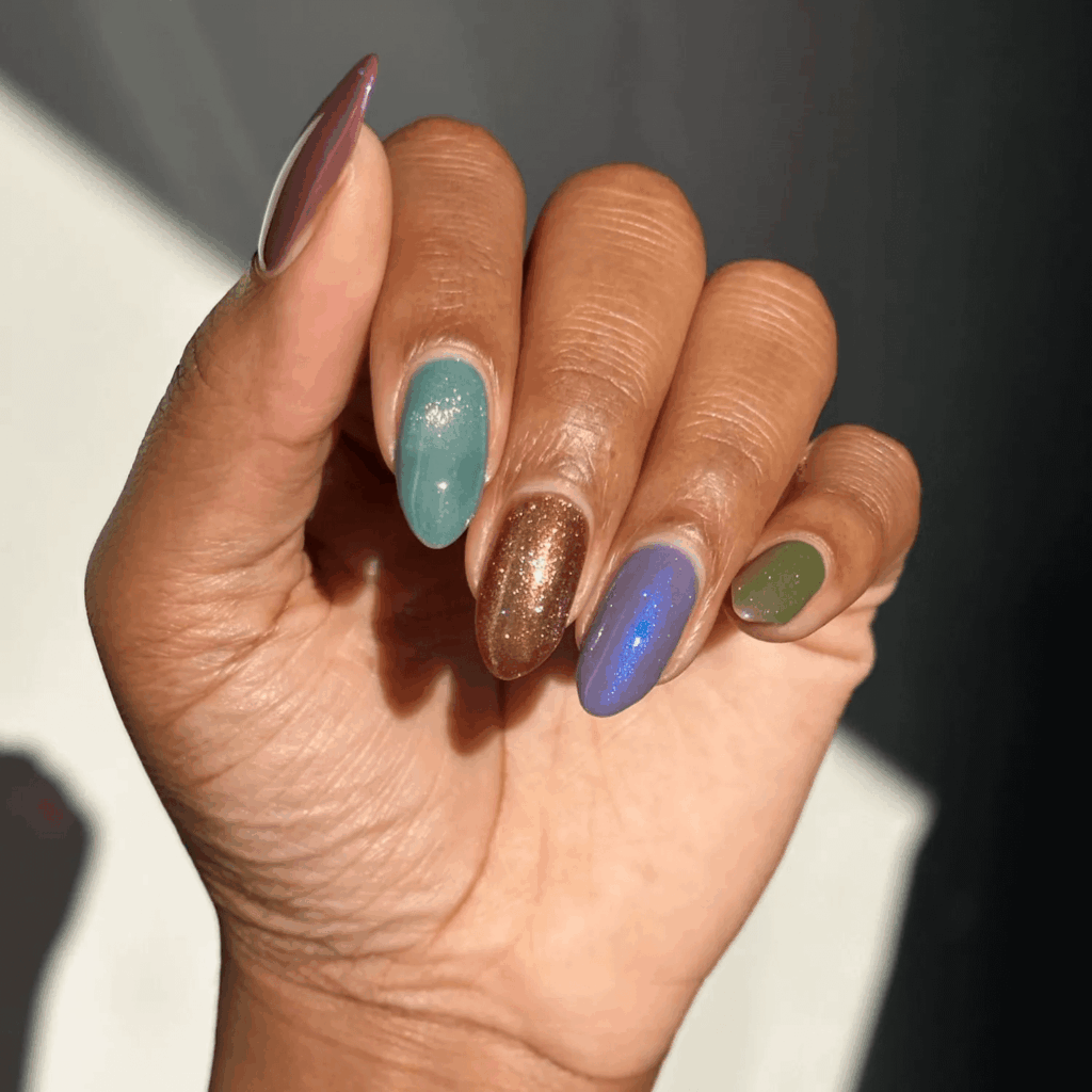 Multi-color iridescent manicure with earthy tones. by brushedbyb_
