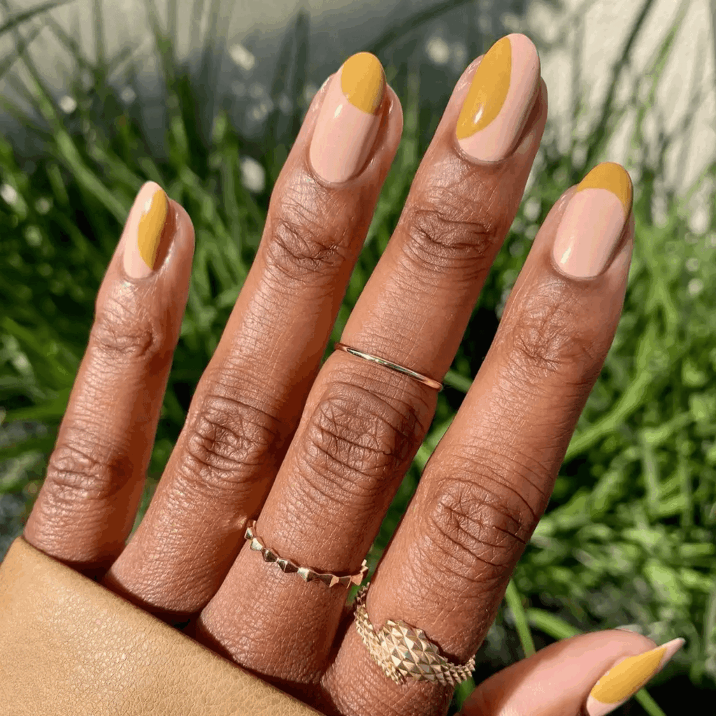 Mustard yellow French tips and half-moon accents on nude nails. by phoebesummernails