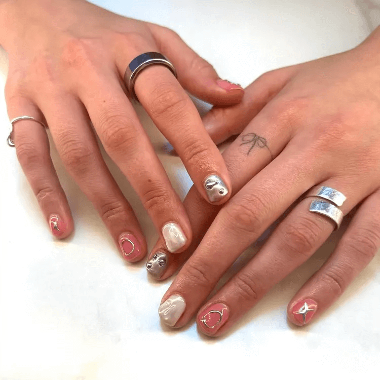 Muted, structured skittle nails with silver foil and 3D accents. by softstarnails
