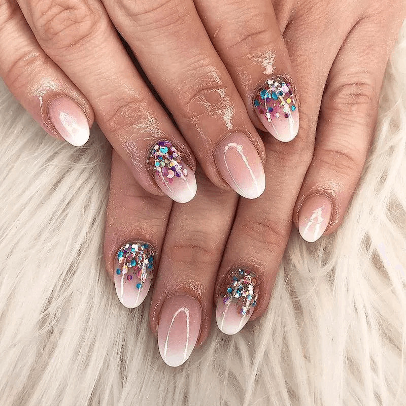 Nude ombré nails with glitter along the cuticle. by nailbeautyguide