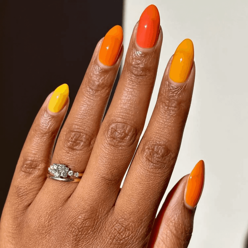 Orange and red jelly gradient nail effect.by melanated.mani
