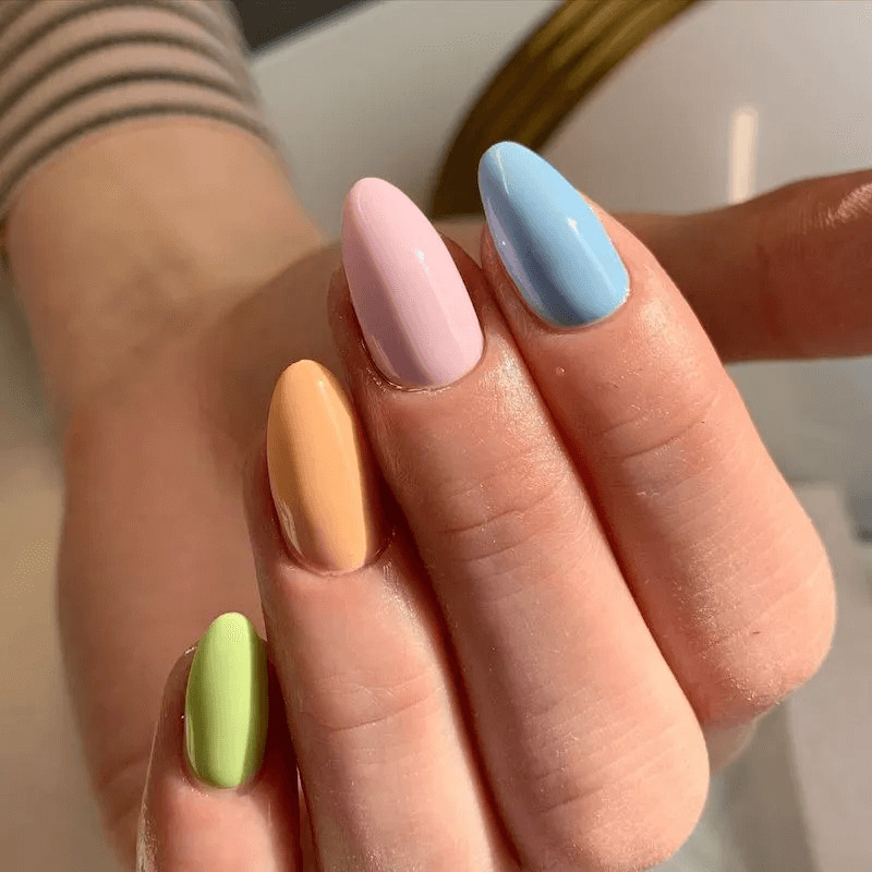 Short acrylics with bright, vibrant rainbow colours. by nailbeautyguide
