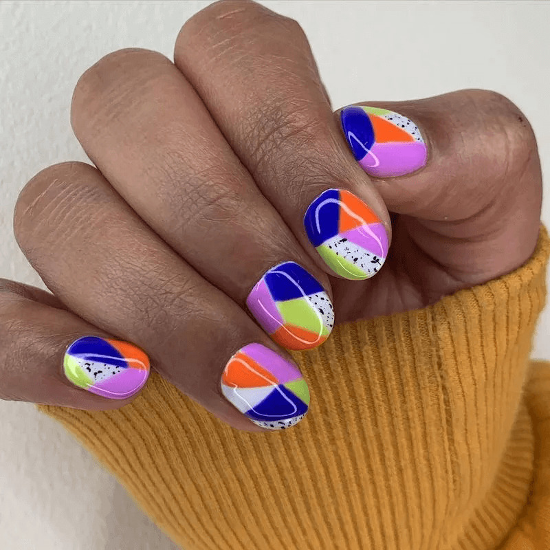 Short acrylics with colourful abstract Art Deco designs. by paragonnails
