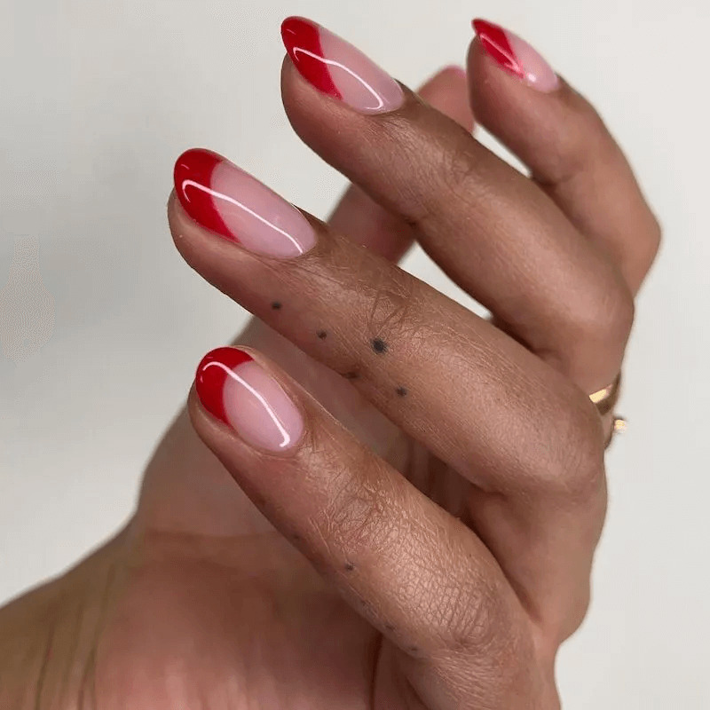 Short acrylics with vibrant red French tips. by paragonnails