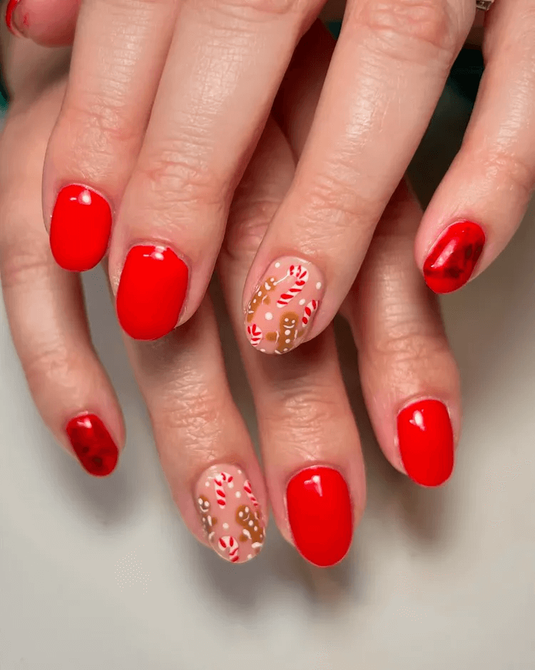 Short red nails mixed with candy cane and gingerbread man art. by nails_by__bridgett