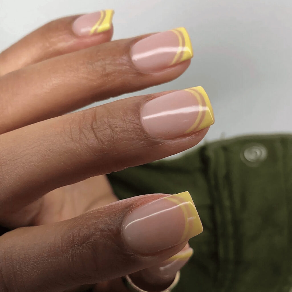Short, square acrylics with yellow openwork French tips. by glammertized