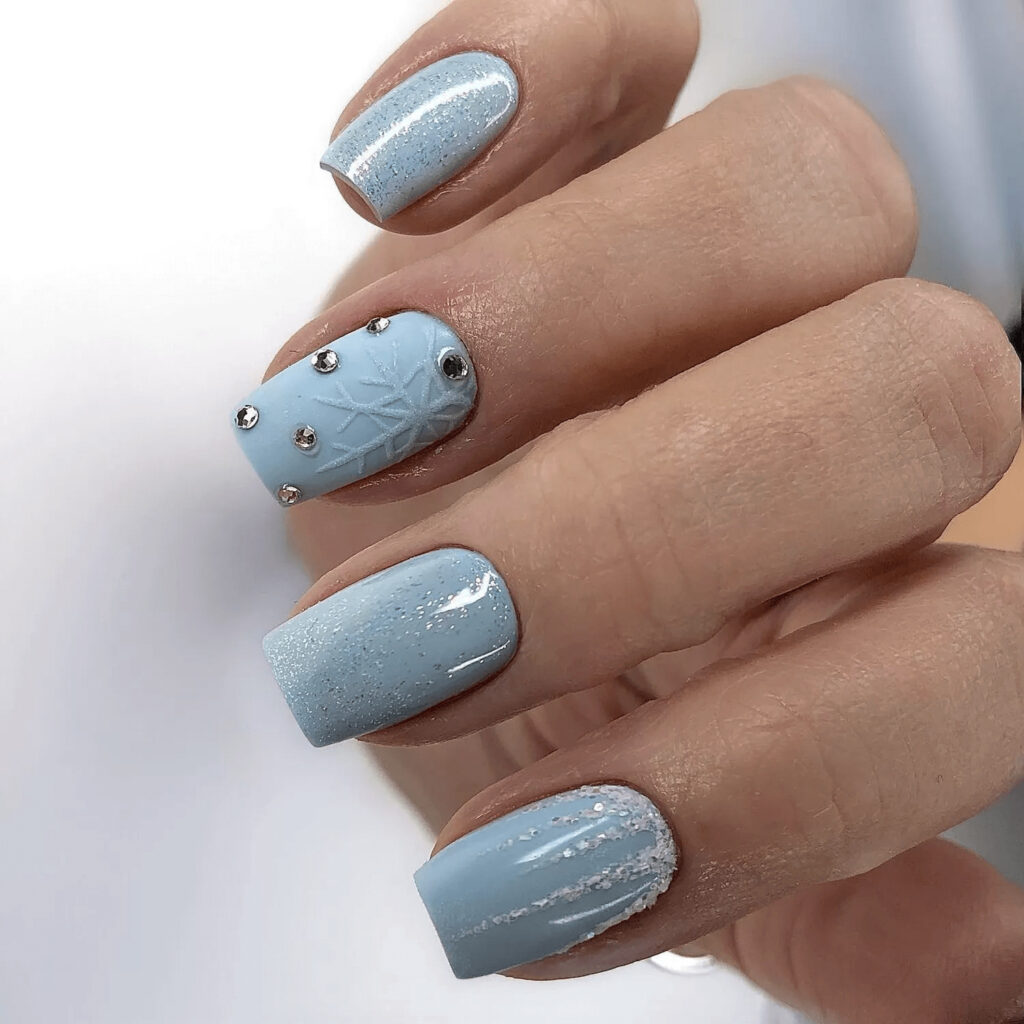Square-shaped baby blue acrylics with icy motifs. by glammertized
