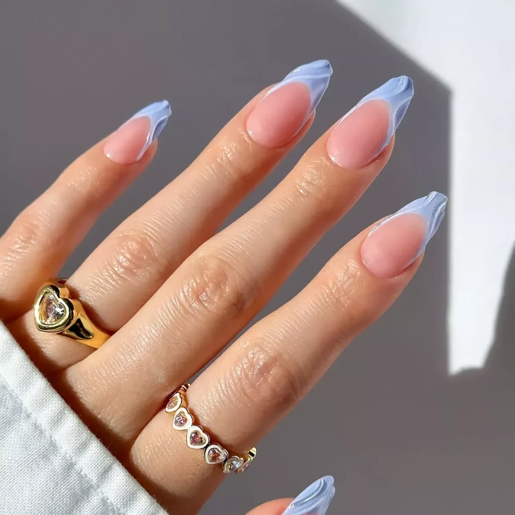 A light blue manicure with clear builder gel swirl accents. by brushedbyb_