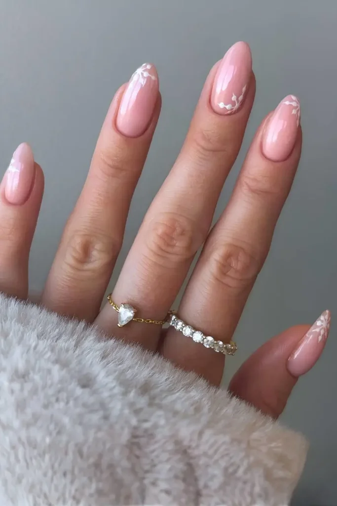 Almond milky nails with snowflake art. by aimeestokesbeauty