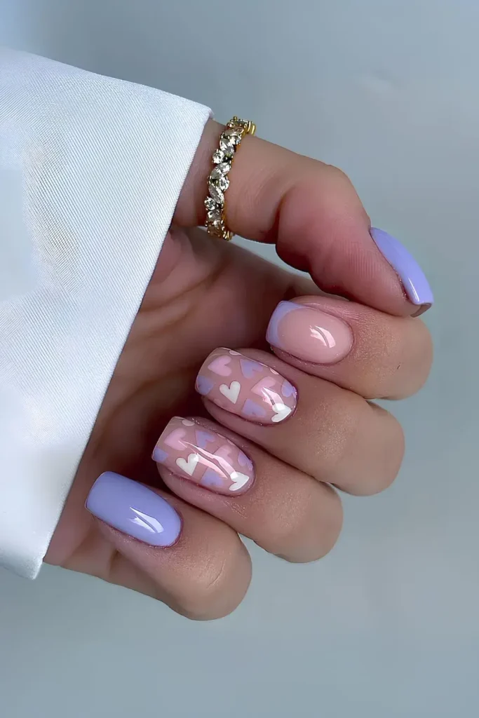 Bright purple manicure accented with tiny pink hearts. by nails.by.iz_
