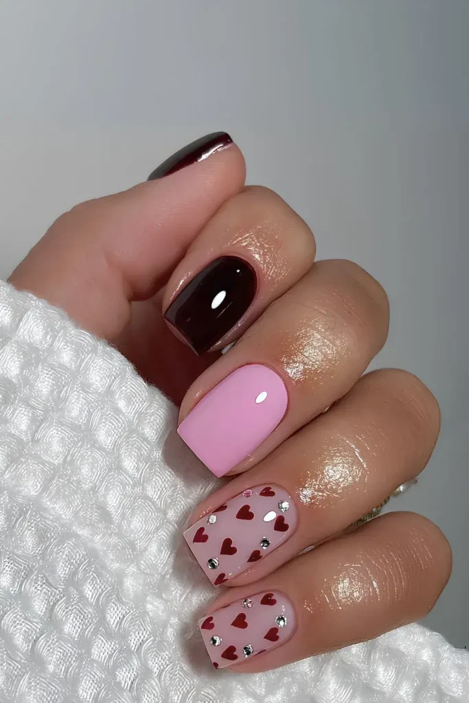 Bubblegum pink and black solid nails with red hearts and gems. by gieos.room