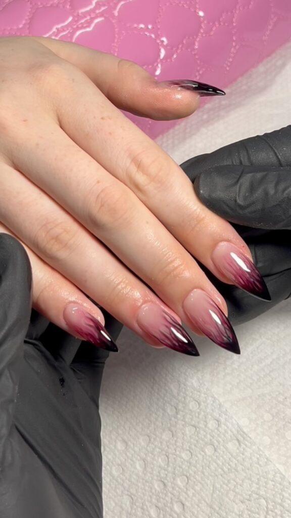 Close-up image of bold, extra-long stiletto shaped nails, tapering aggressively to a sharp point. by beautybyhillsxx