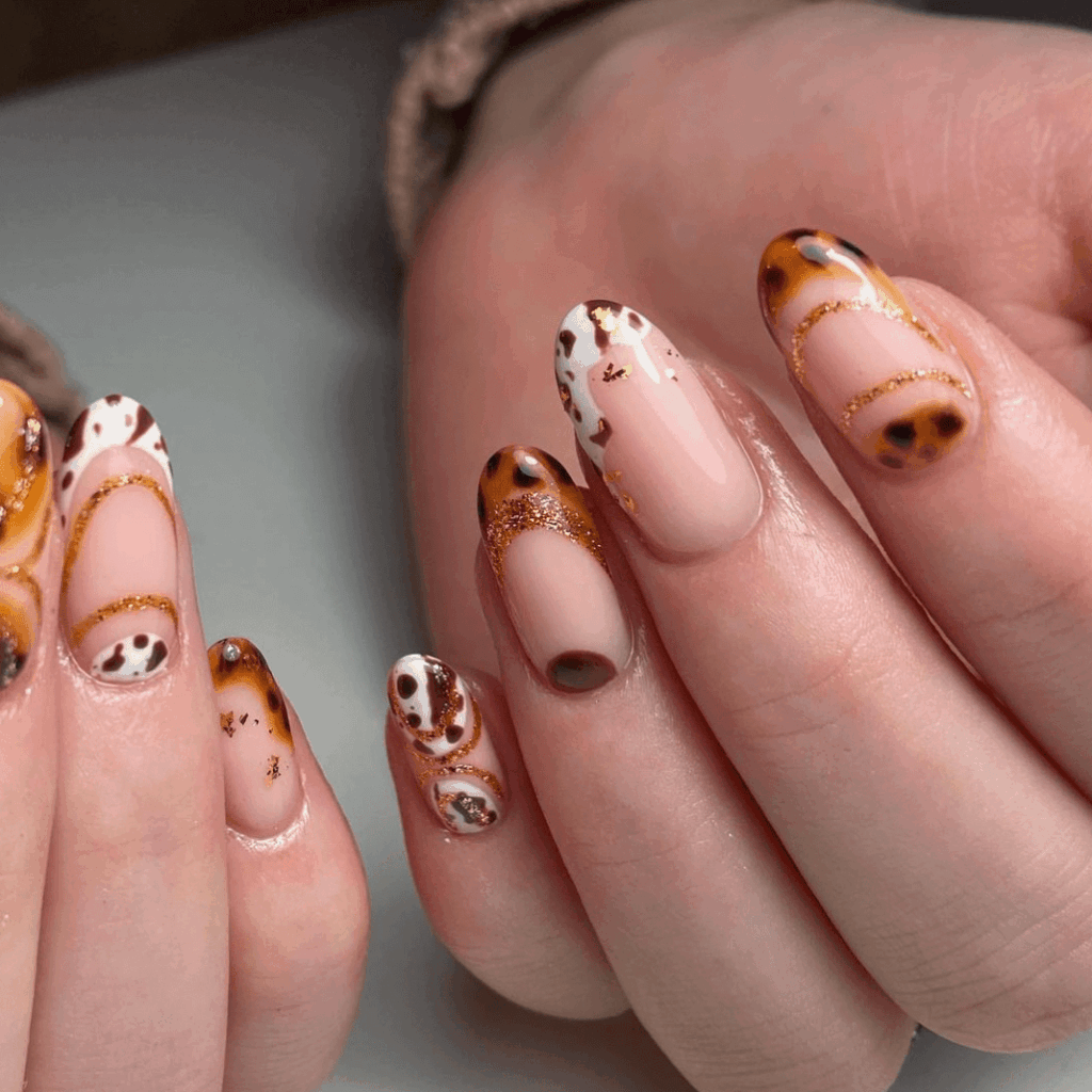 Combination of tortoise and cow print designs. by nailartbychlo