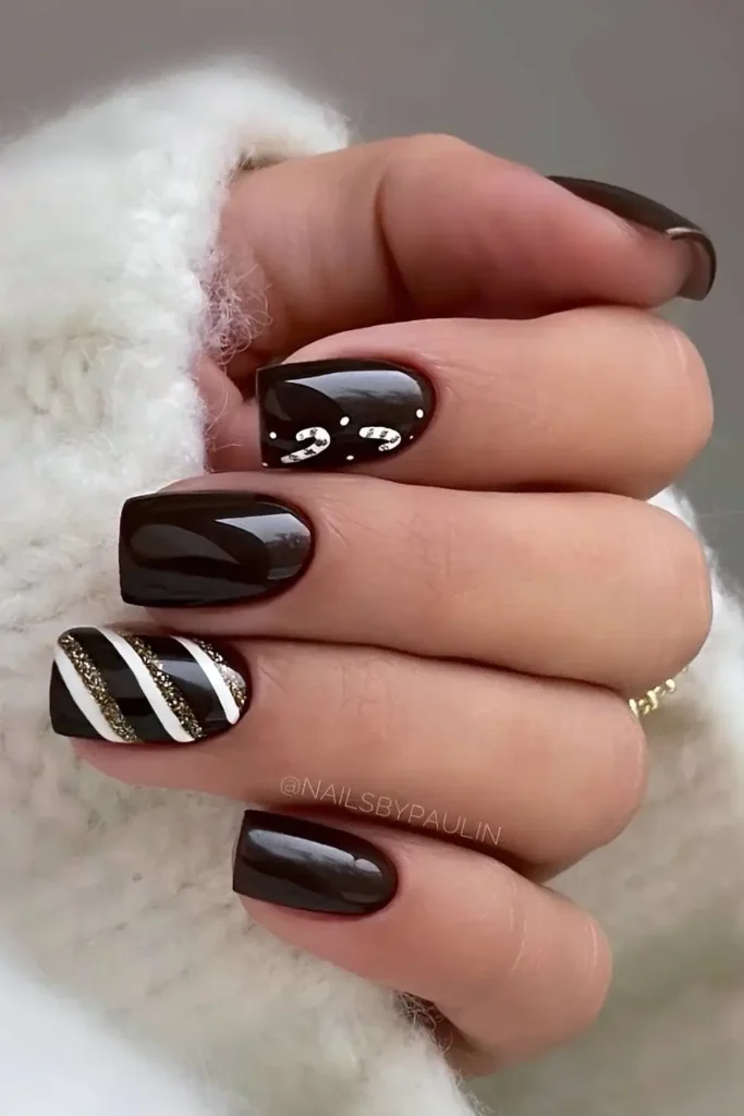 Dark brown nails with candy cane stripes. by nailsbypaulin
