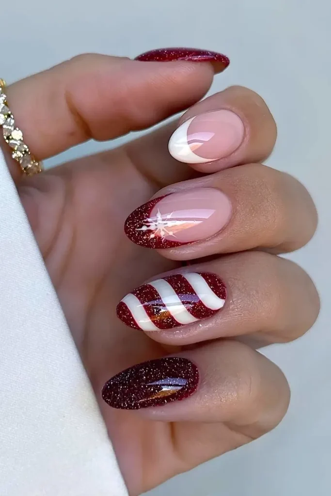 Dark red and white candy cane nails. by nails.by.iz_