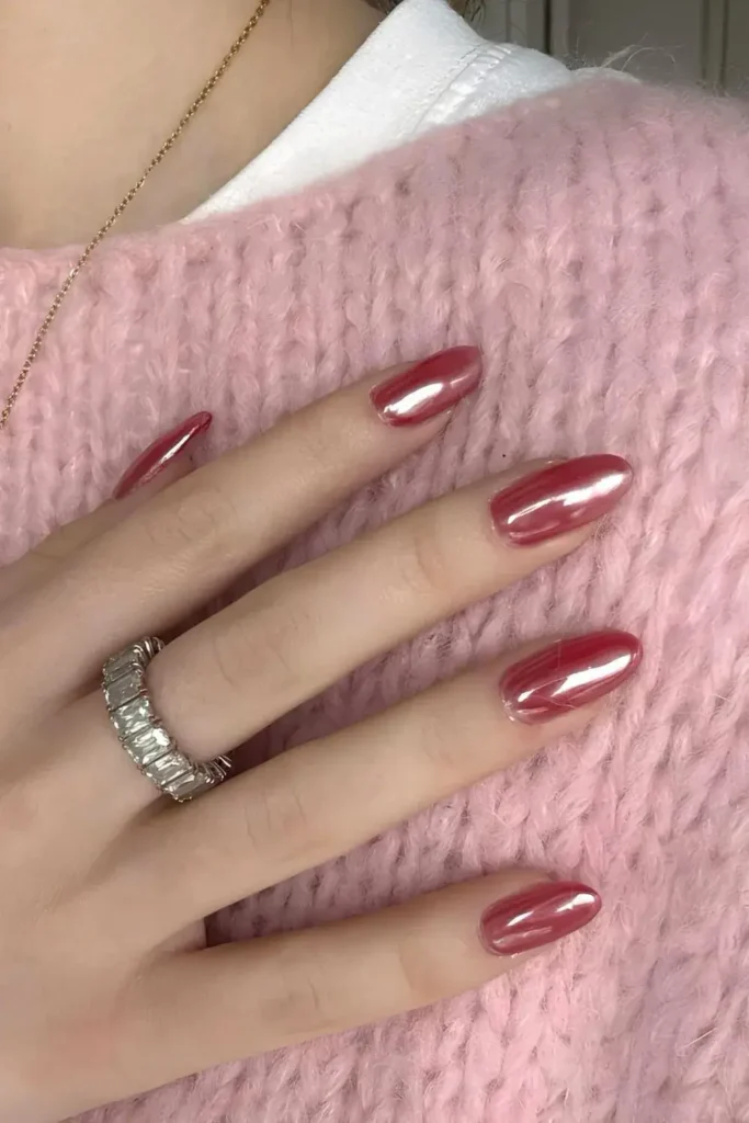 Glazed cherry red manicure with a high-shine chrome finish. by nailbeautyguide