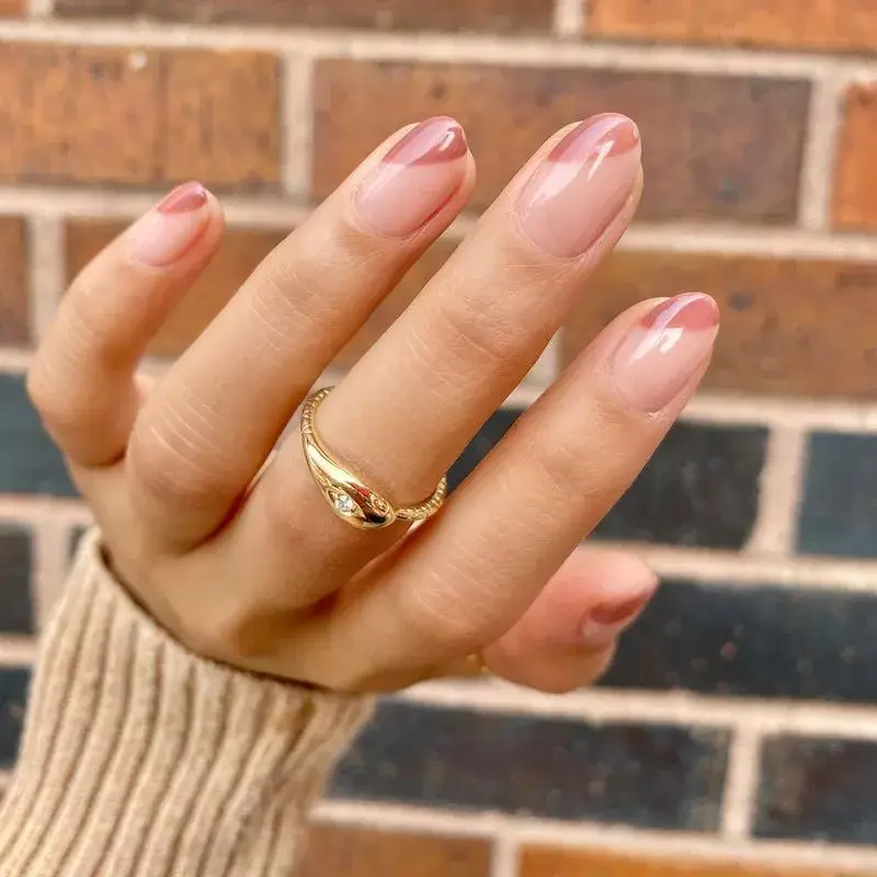 Image of clear nails with a single short, diagonal mauve line painted on the side. by amyytran
