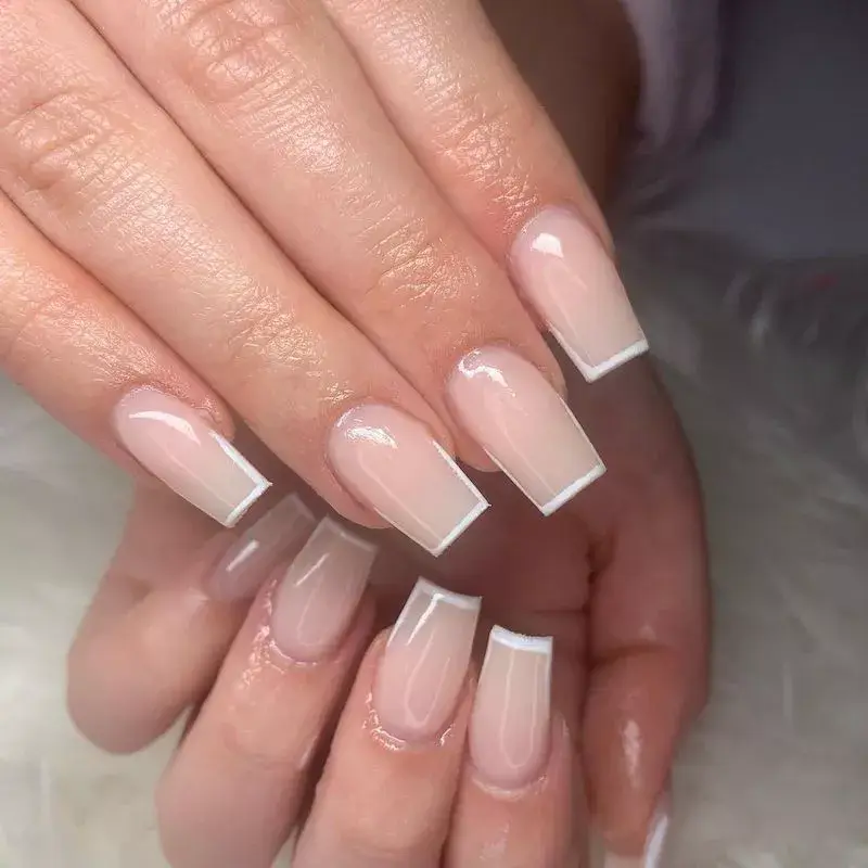 Image of medium square acrylic nails with a soft, milky pink finish. by nailssbymk