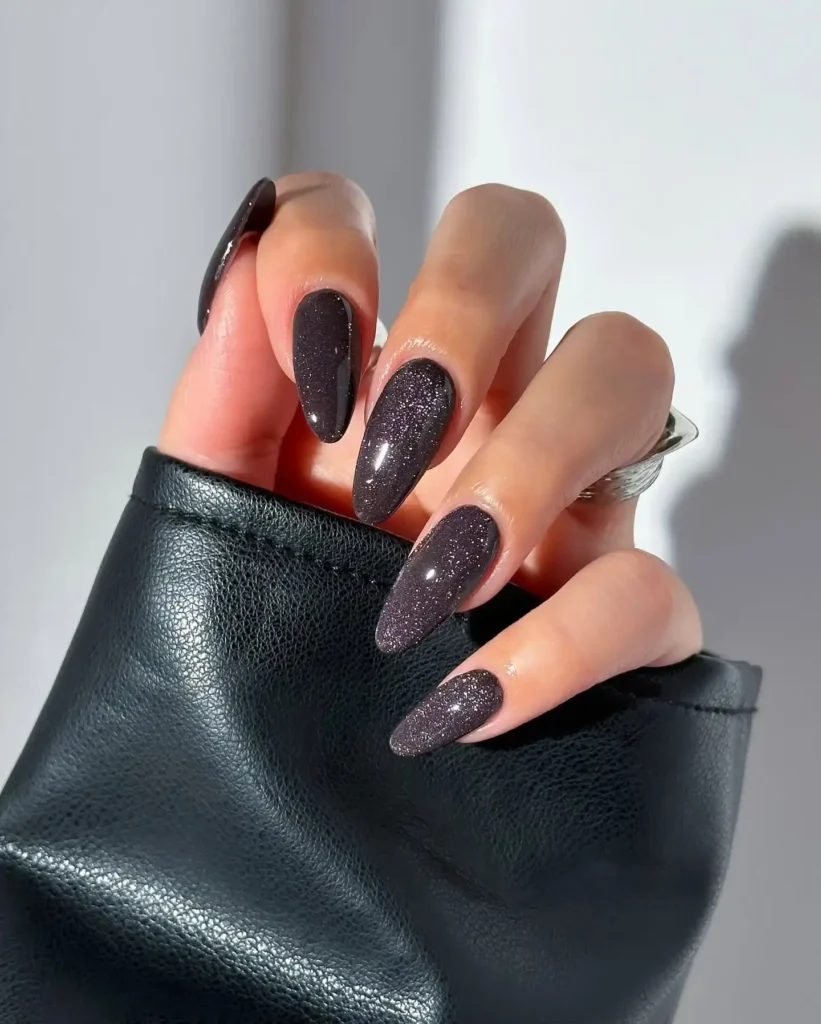 Image of nails painted in a deep gray magnetic velvet polish. by disseynails