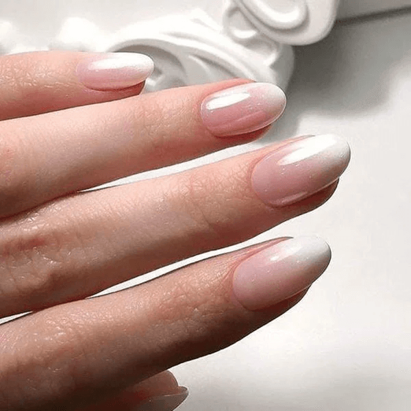 Image of short nails filed into a gentle, natural-looking round shape. by nailbeautyguide