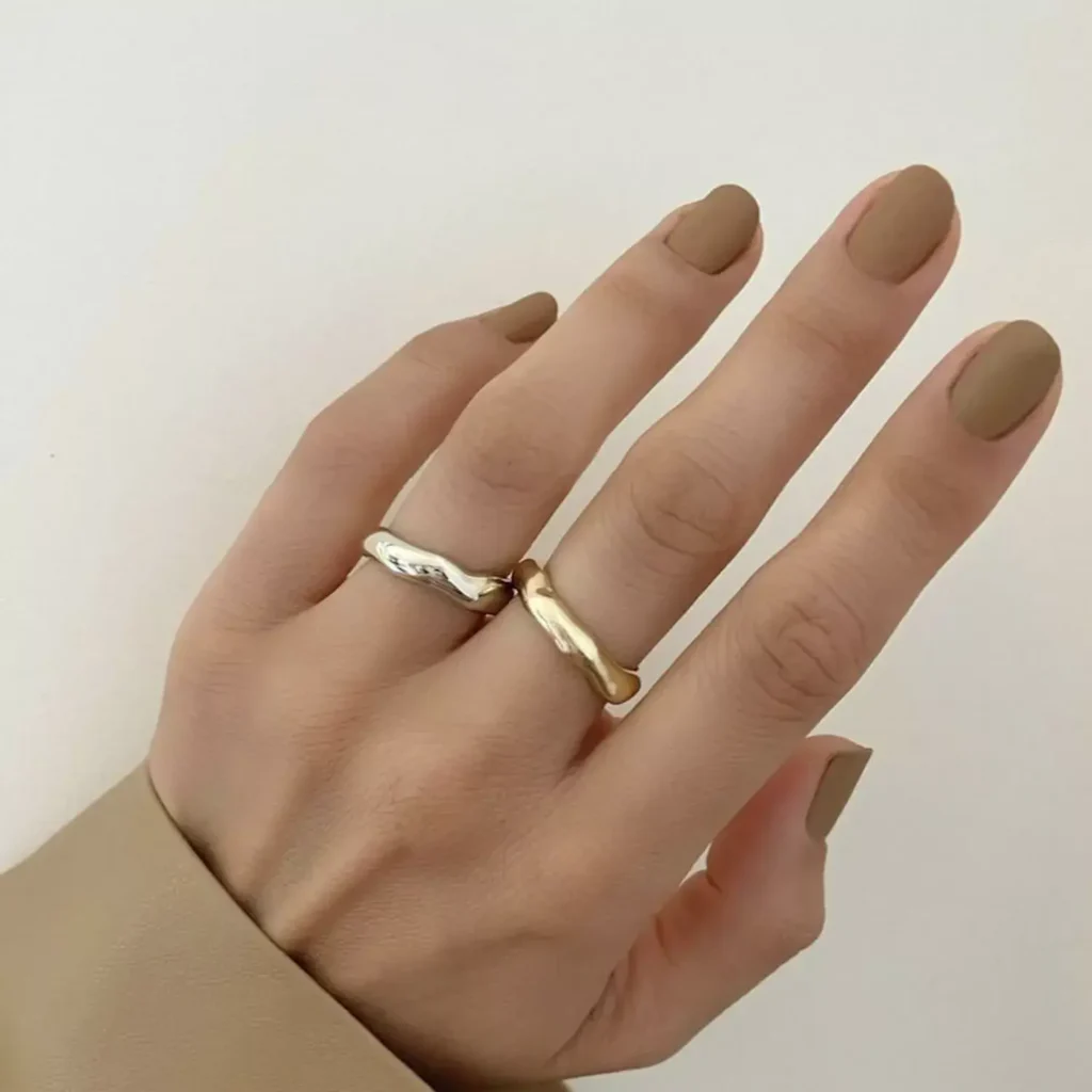 Image of short, square nails painted a matte neutral beige color. by betina_goldstein