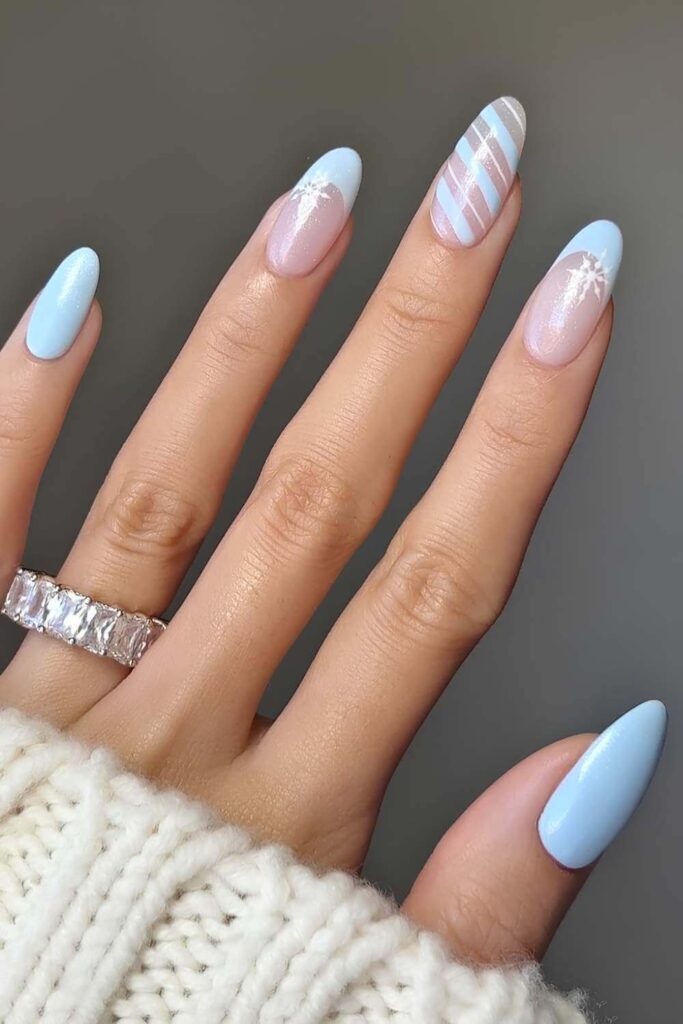 Light blue Christmas nails with stripes. by nailsbyalsn