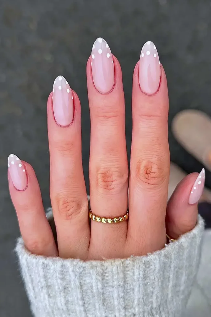 Milky white nails with polka dots at the tips. by nailsbycaroline_