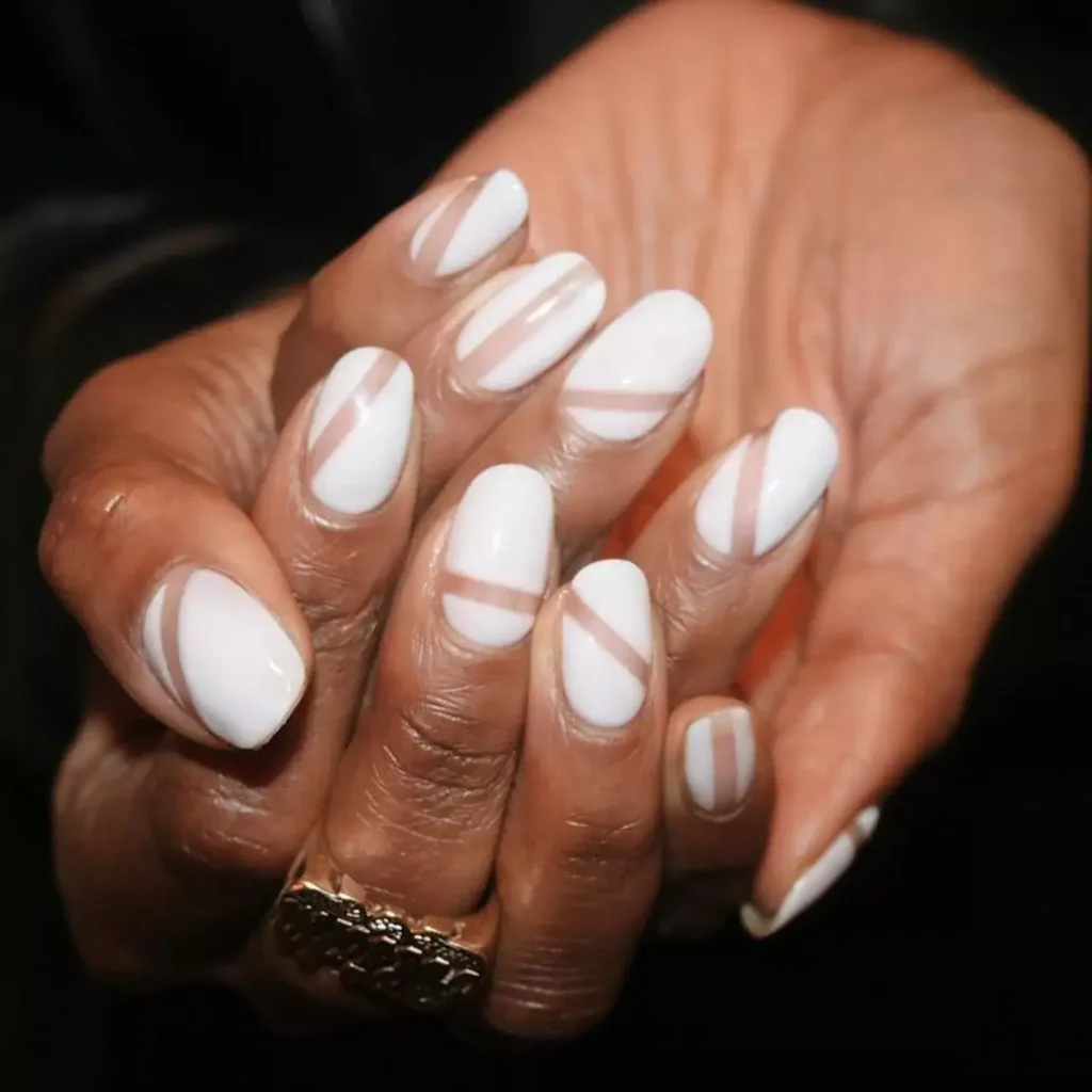 Modern white nails with negative space stripes. by imarninails