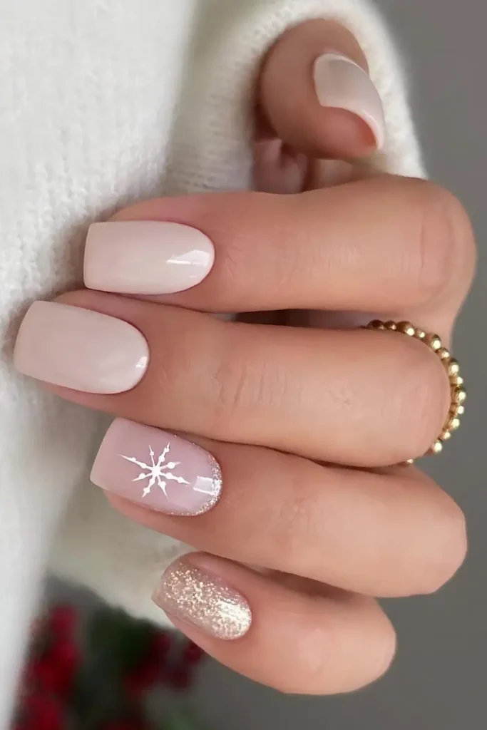 Neutral Christmas nails with glitter and snowflakes. by nailsbypaulin