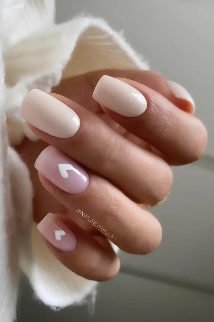 Neutral nails with a subtle heart accent. by nailsbypaulin