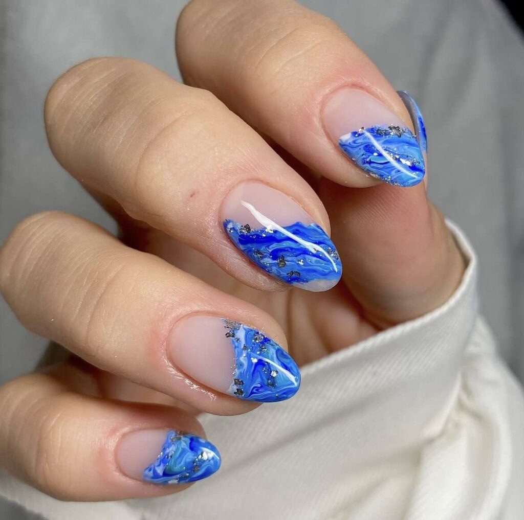 Neutral nude color, paired with an abstract blue ocean design, accented with a light touch of chrome. by beautique_kent
