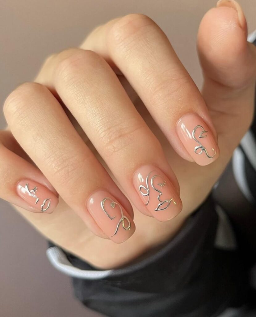 Neutral nude color, paired with chrome abstract art. by nailsbyheathere
