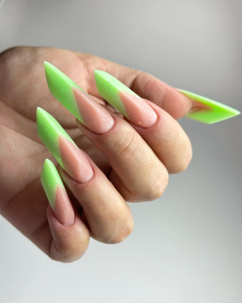 Photo of the complex Edge nail shape, featuring sharp structural angles and a central ridge. by arianamelomasternails