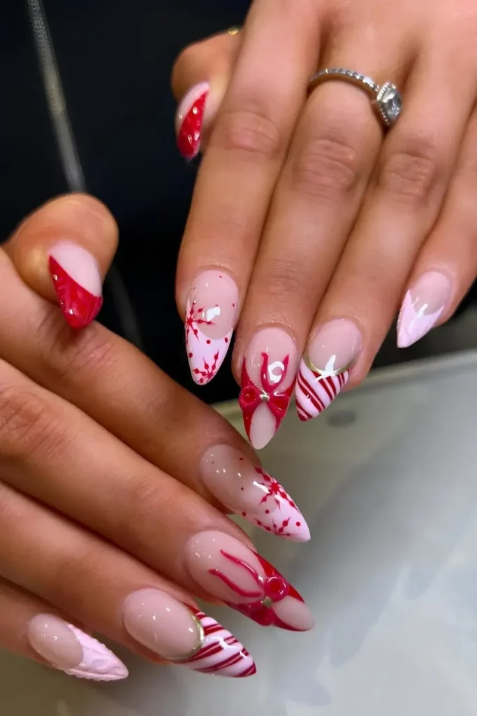 Pink and red nails with bows and candy canes. by bylydiarose__