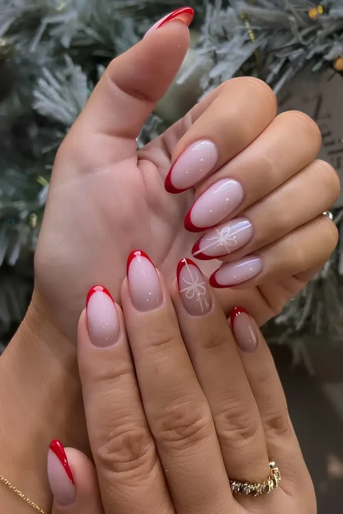 Red Christmas French nails with bows. by nailsatnats