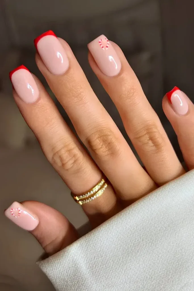 Red French mani with minimalist candy cane art. by lillypalm__
