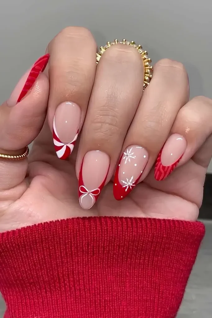 Red French tips with Christmas-inspired art.by nailzkatkat