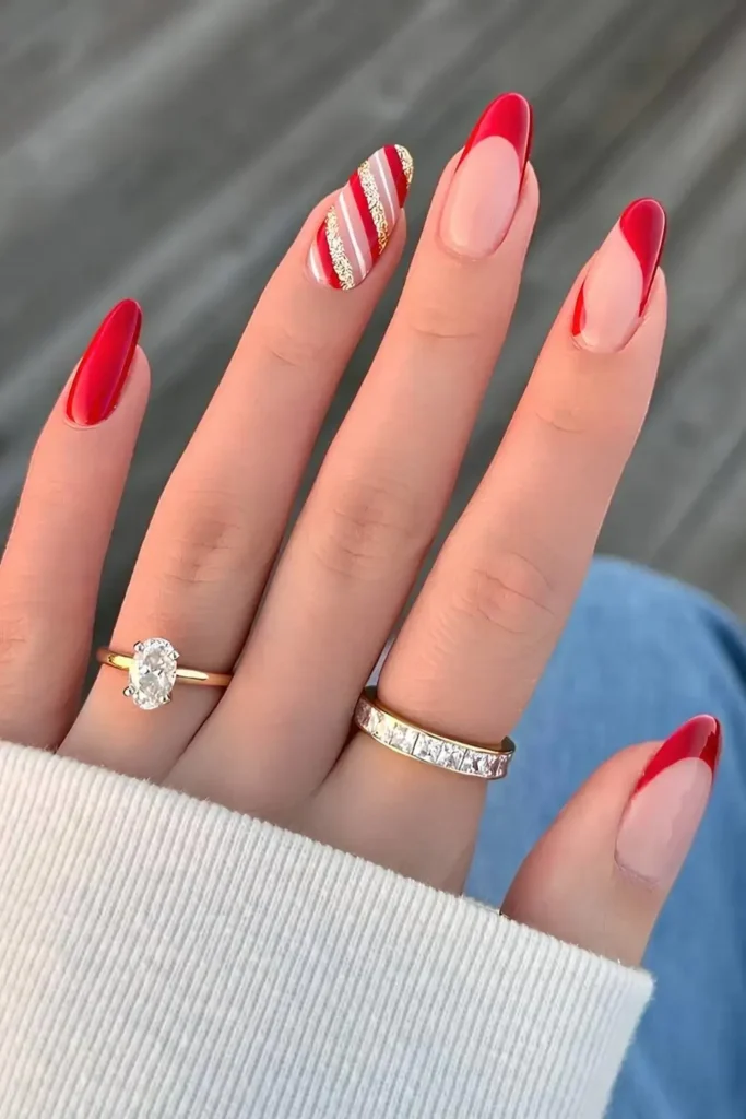 Red and gold Christmas mani with candy cane stripes. by heluviee
